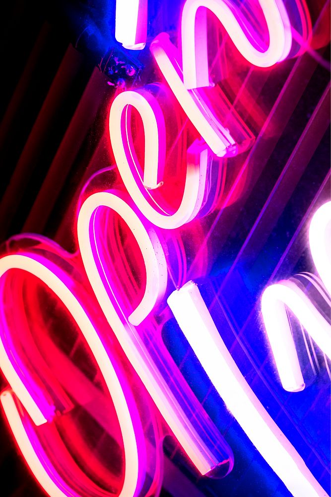 Neon pink open sign on black background