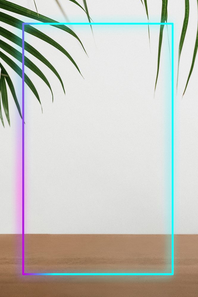 Neon frame with palm leaves by the wall