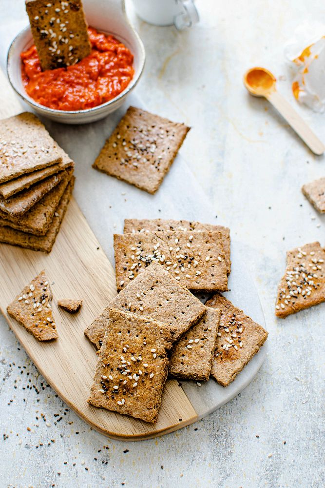 Healthy organic seeded rye crackers with salsa sauce
