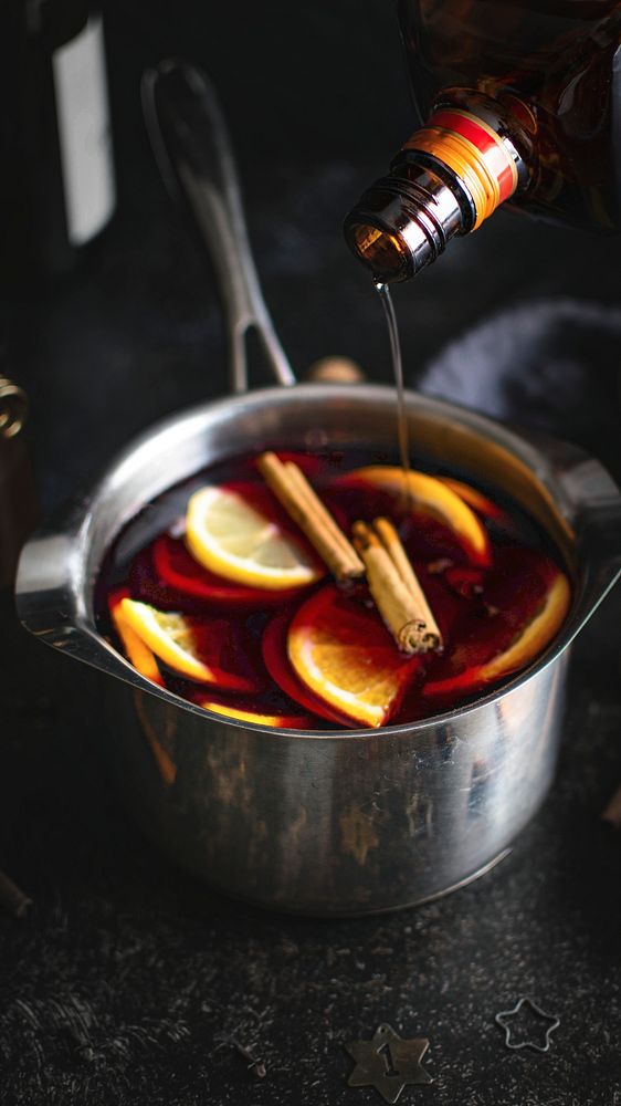 Festive holiday mulled wine in a pot mobile background