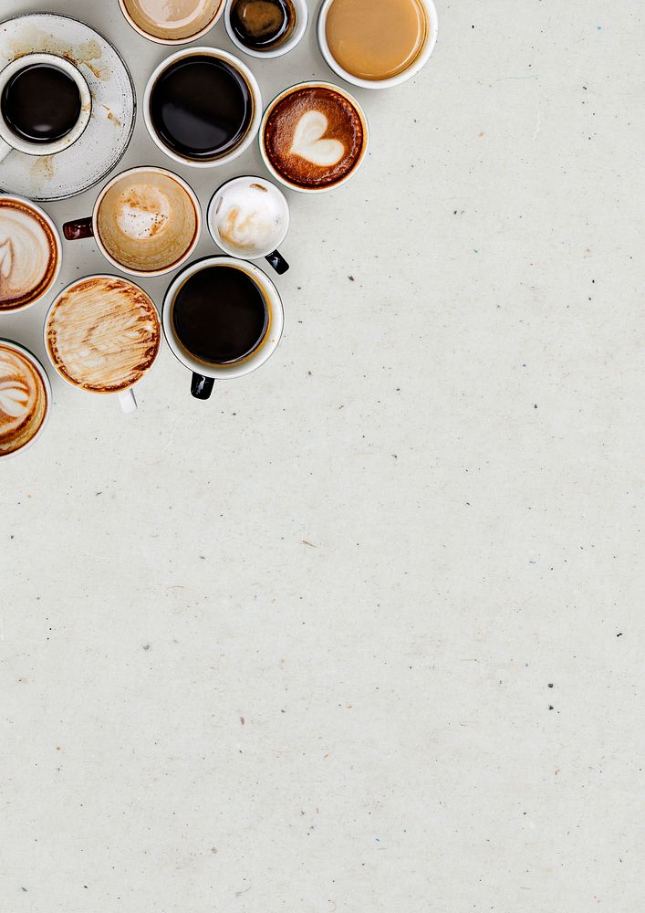 Coffee mugs on a light beige textured wallpaper