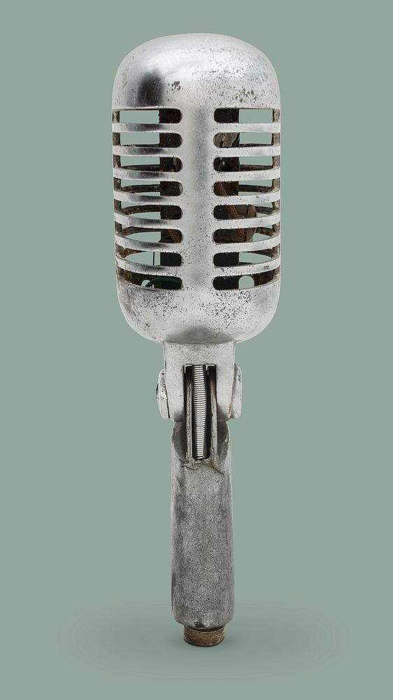 Vintage silver microphone on gray background