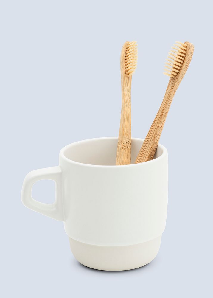 Natural bamboo toothbrush in a cup