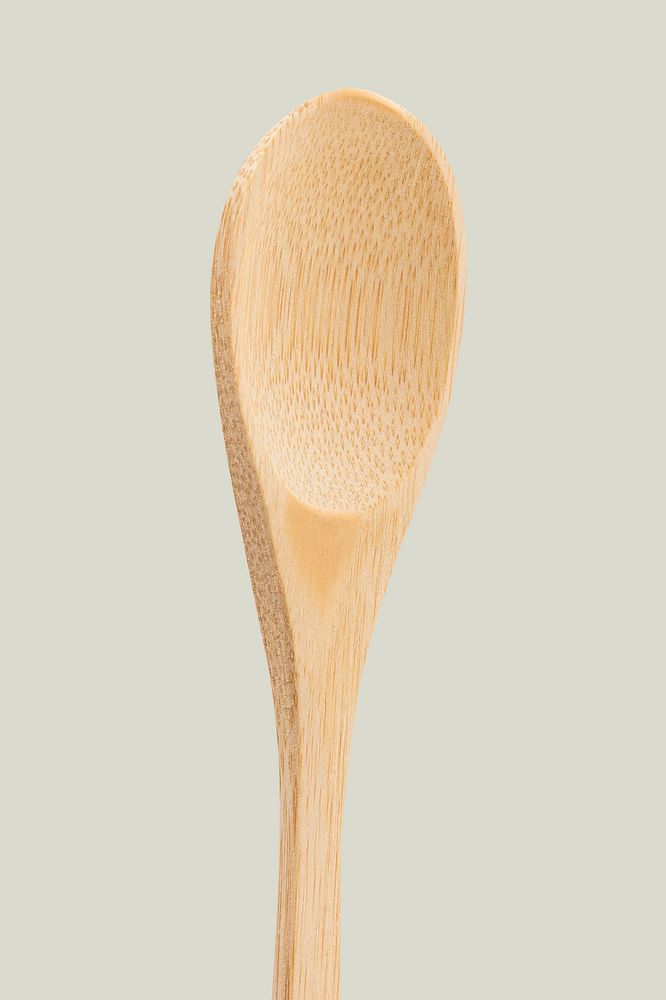 Natural wooden spoon on off white background