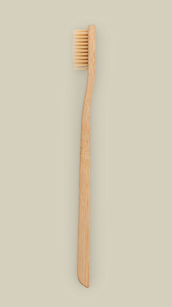 Natural bamboo toothbrush on beige background