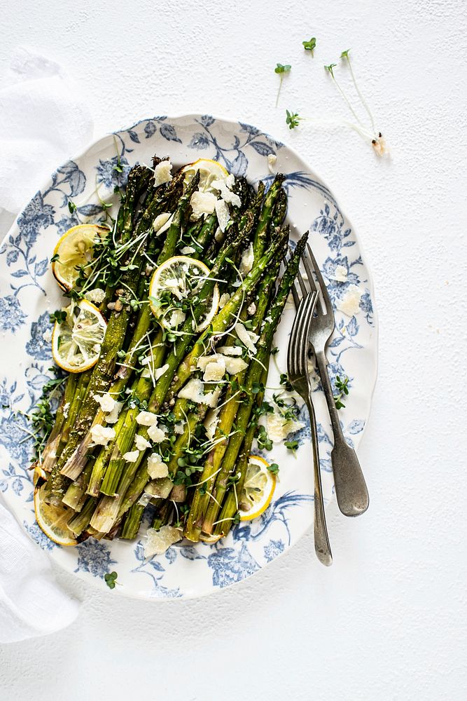 Baked asparagus with lemon in a plate 
