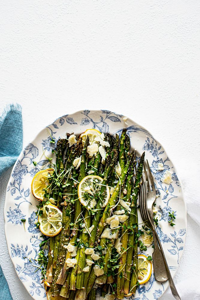 Baked asparagus with lemon in a plate 