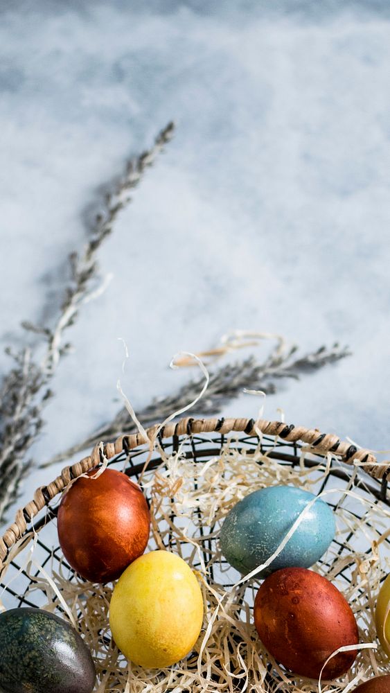Colored Easter eggs in a basket mobile wallpaper. Visit Monika Grabkowska to see more of her food photography.
