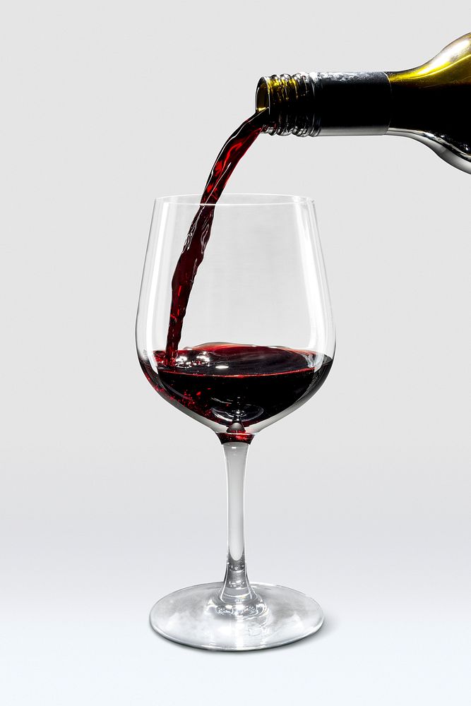 Red wine glass mockup with wine pouring in