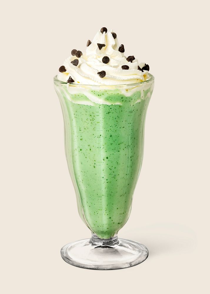 Matcha smoothie topped with whipped cream on background 