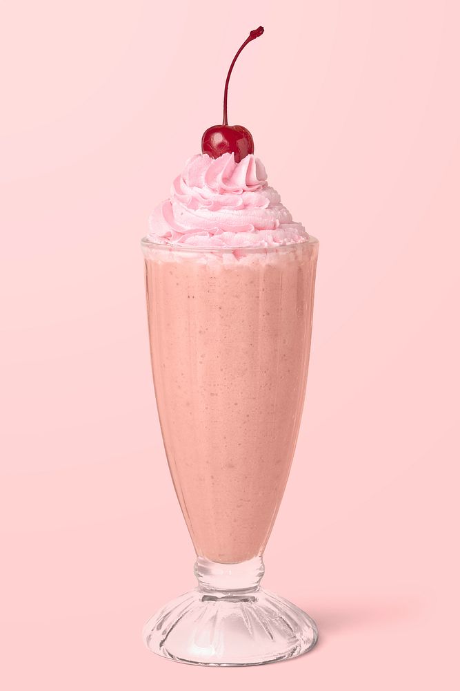 Strawberry milkshake with a maraschino cherry on background