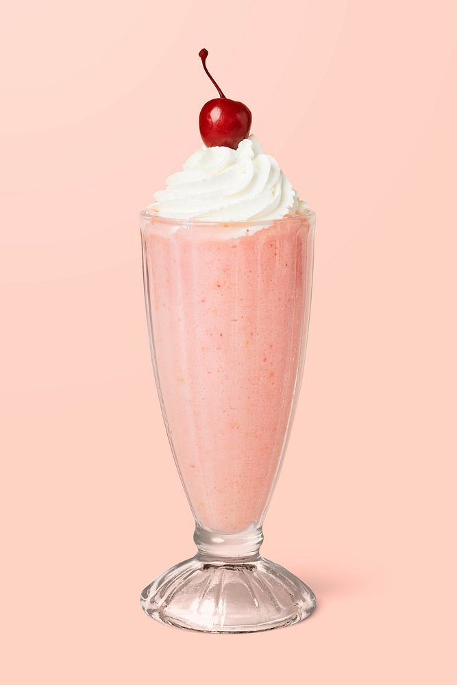 Strawberry milkshake with a maraschino cherry on background