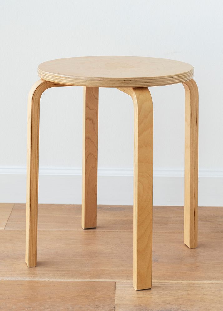 Round wooden stool on a wooden floor