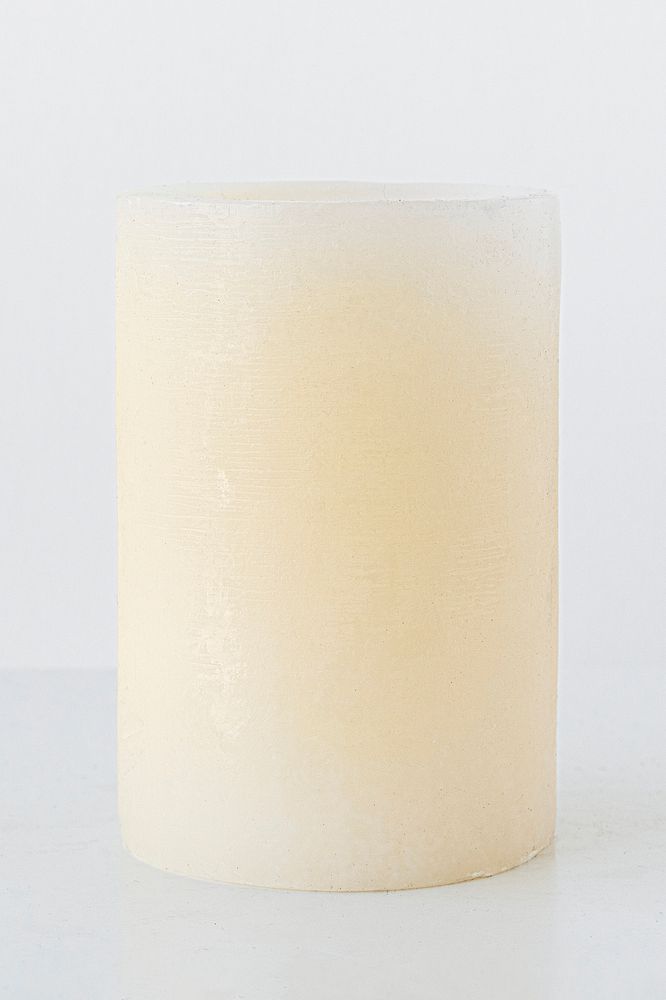 White ivory pillar candle bulk on white background