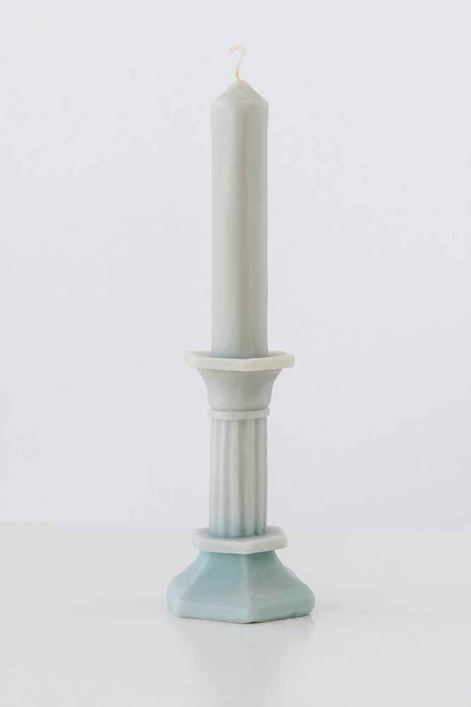 Vintage white wax candlestick on white background