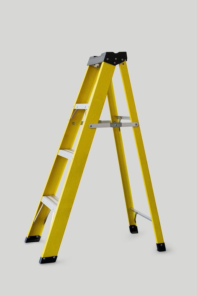 Yellow ladder on gray background