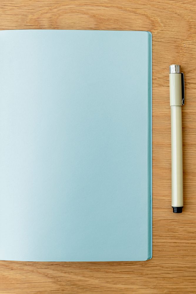 Blank plain blue notebook page with a pen mockup