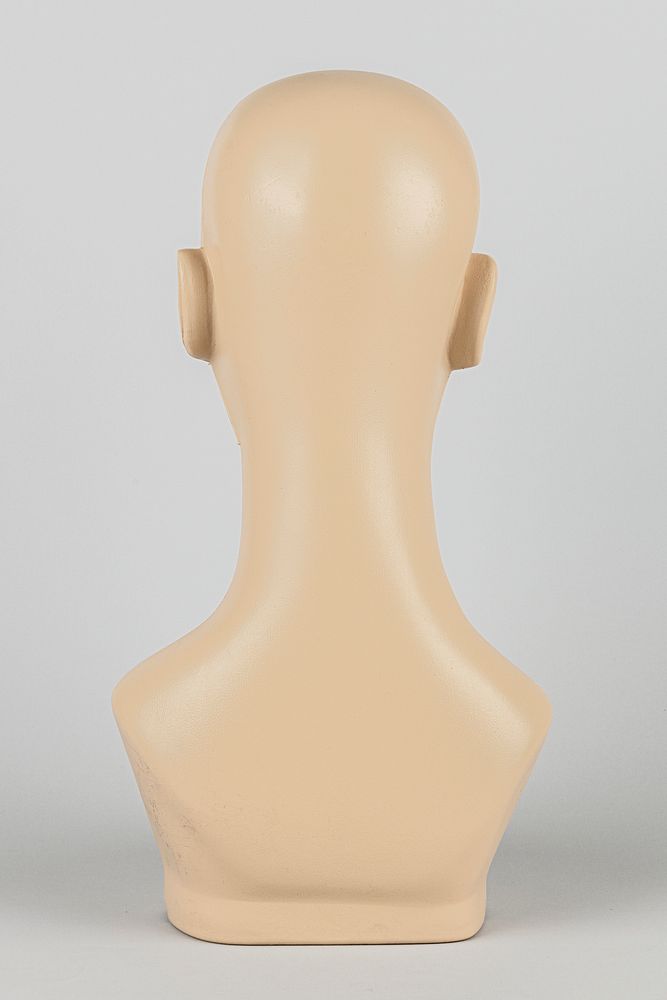 Rear view of a flesh tone mannequin head mockup