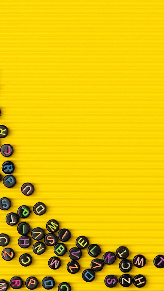 Black alphabet beads yellow phone wallpaper