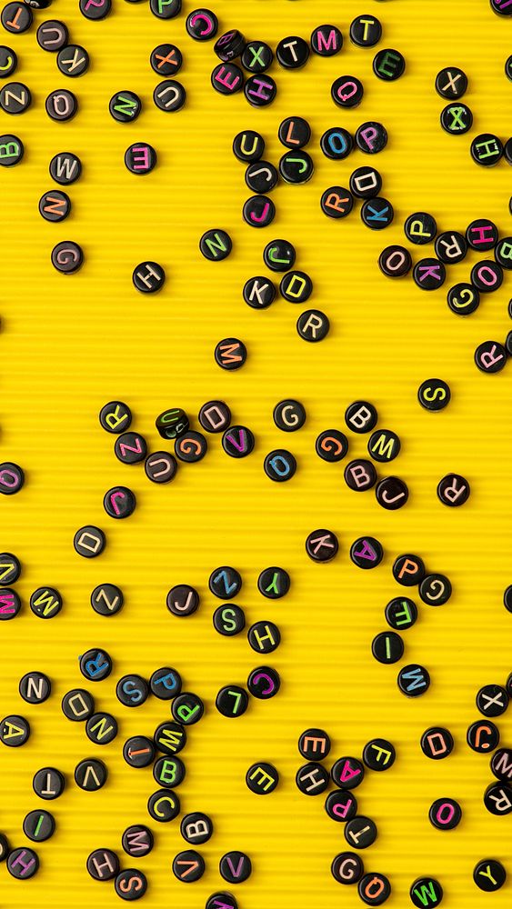 Black letter beads yellow phone wallpaper background