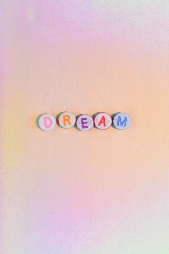 Colorful DREAM beads text typography on pastel