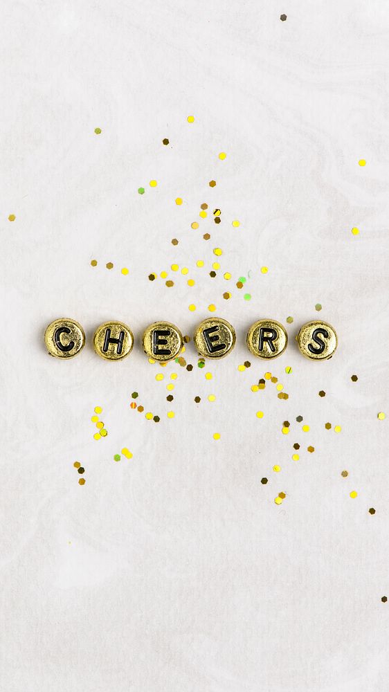 Gold CHEERS beads message typography on white