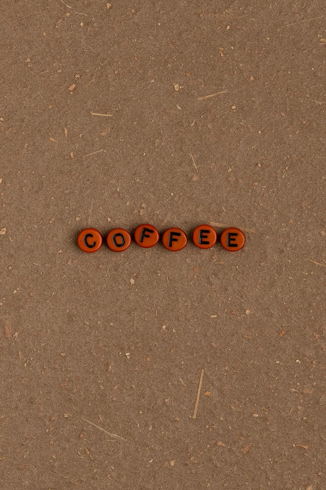 COFFEE beads message typography on brown