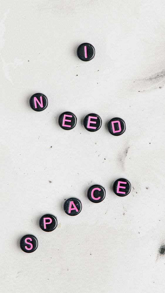 I NEED SPACE black beads word typography on stone