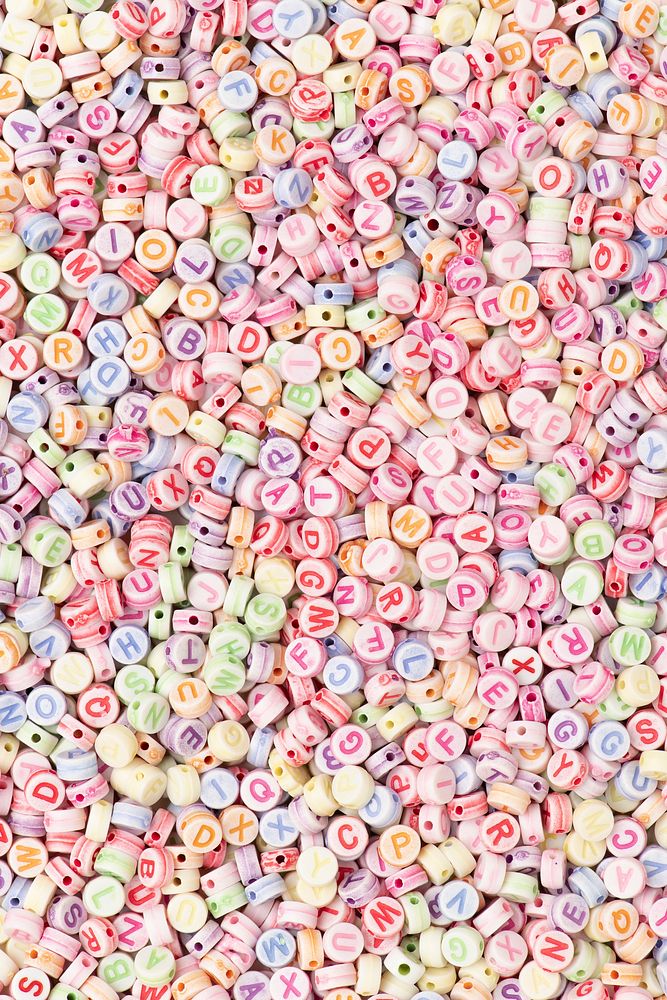 Pastel English alphabet beads background