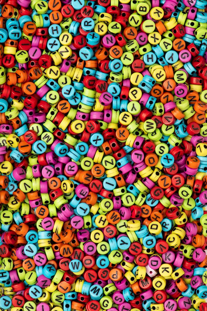 Colorful English letter alphabet beads wallpaper background