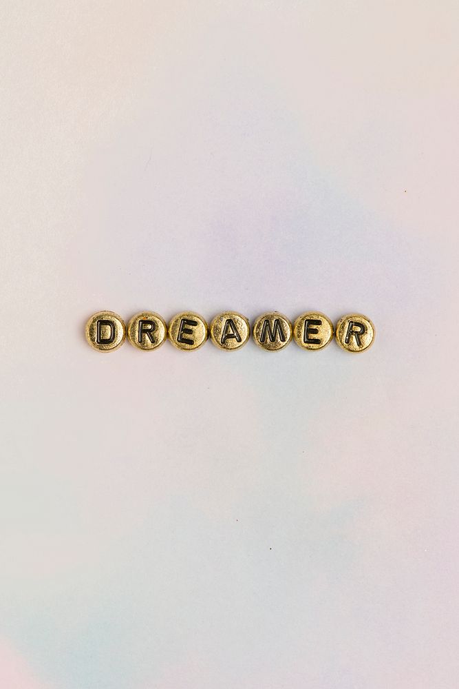 Gold DREAMER beads text typography