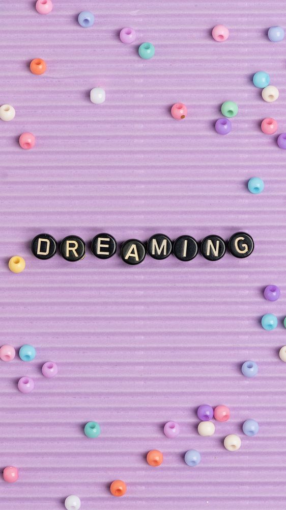 DREAMING beads word typography on purple
