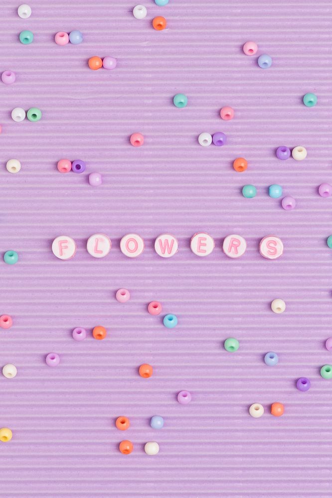 Beads letter flowers typography purple background