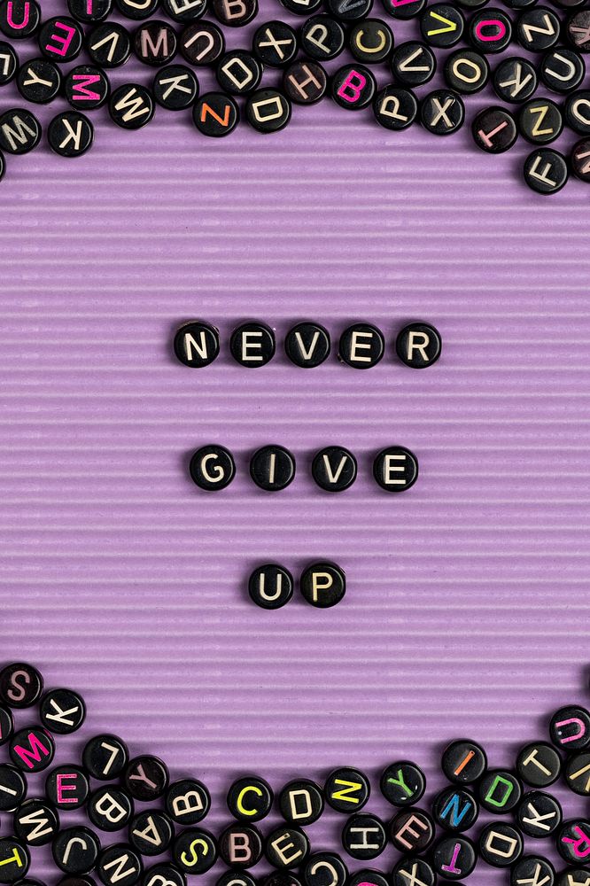 NEVER GIVE UP beads message typography