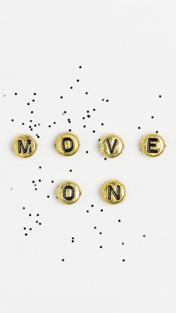 Gold MOVE ON beads word typography