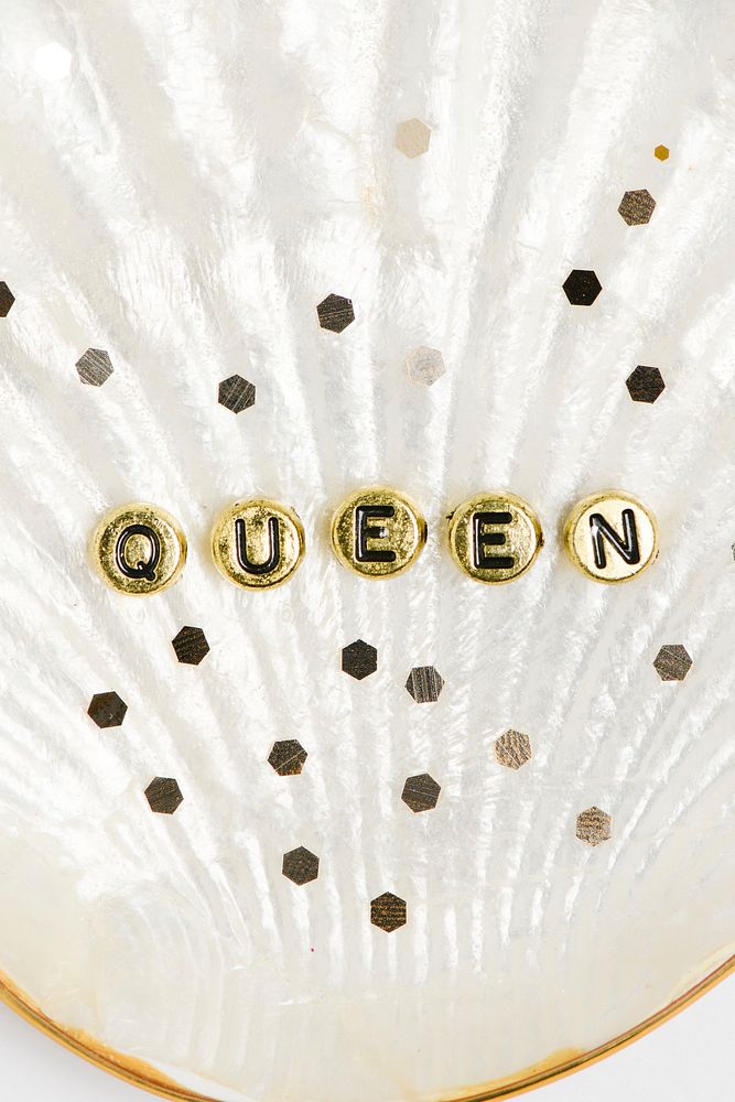 Queen word beads lettering in a shell 