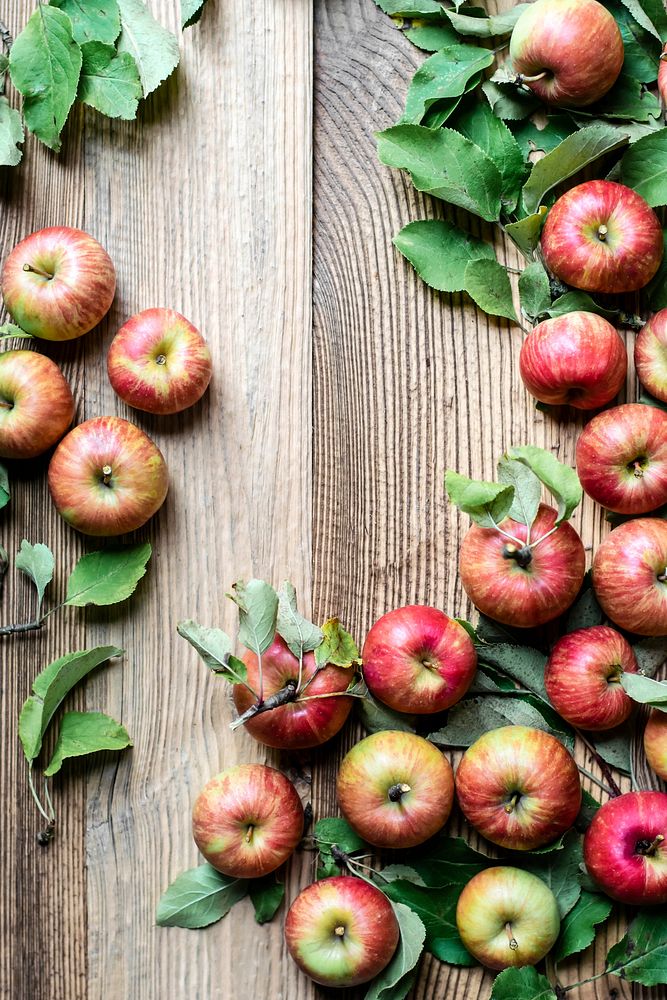 Red apples and leaves background