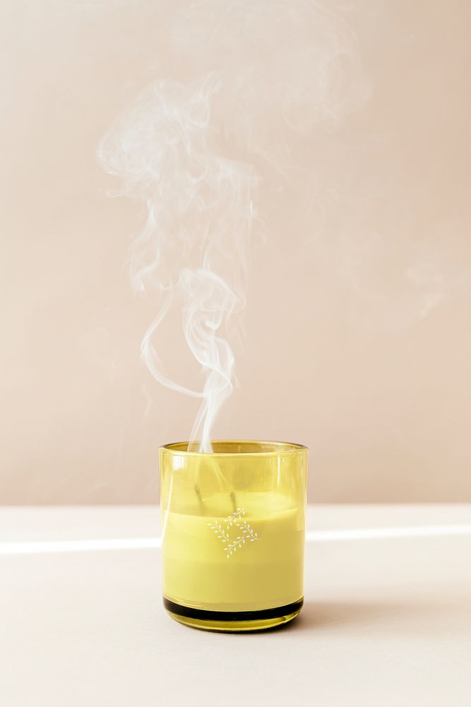 Smoke from a blown-out glass candle