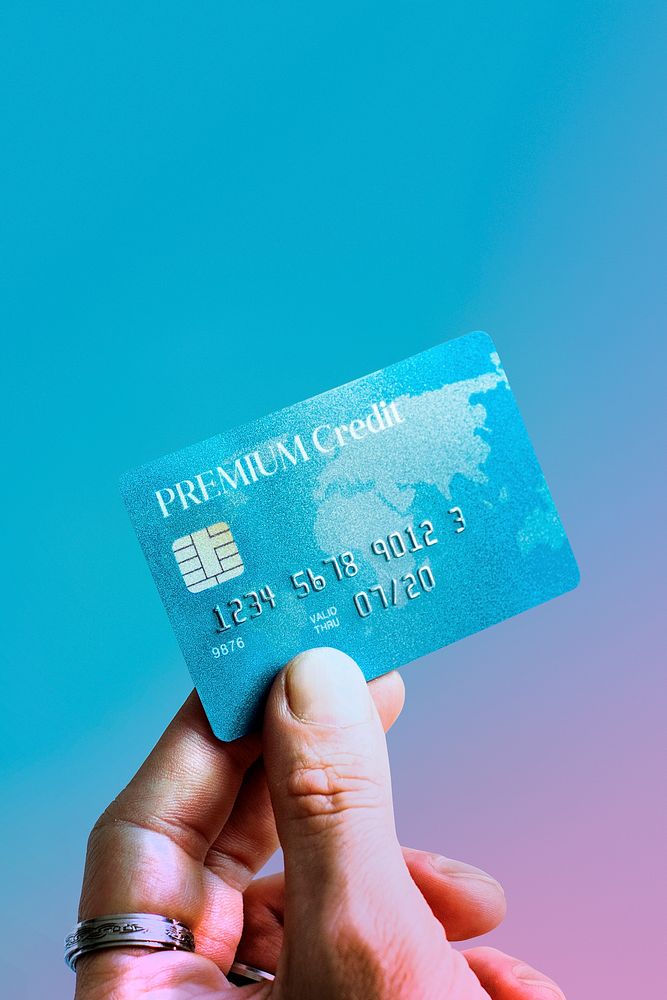 Woman holding a premium credit card