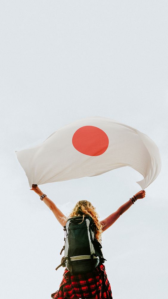 Woman holding the Japanese flag mobile wallpaper