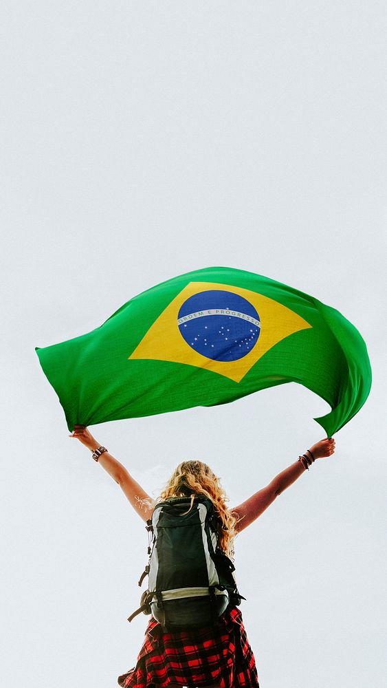 Woman holding the Brazilian flag mobile wallpaper