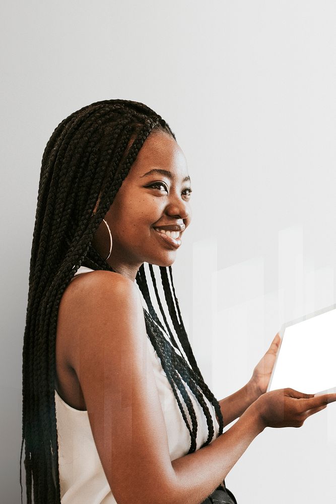 Cheerful black woman using a digital tablet