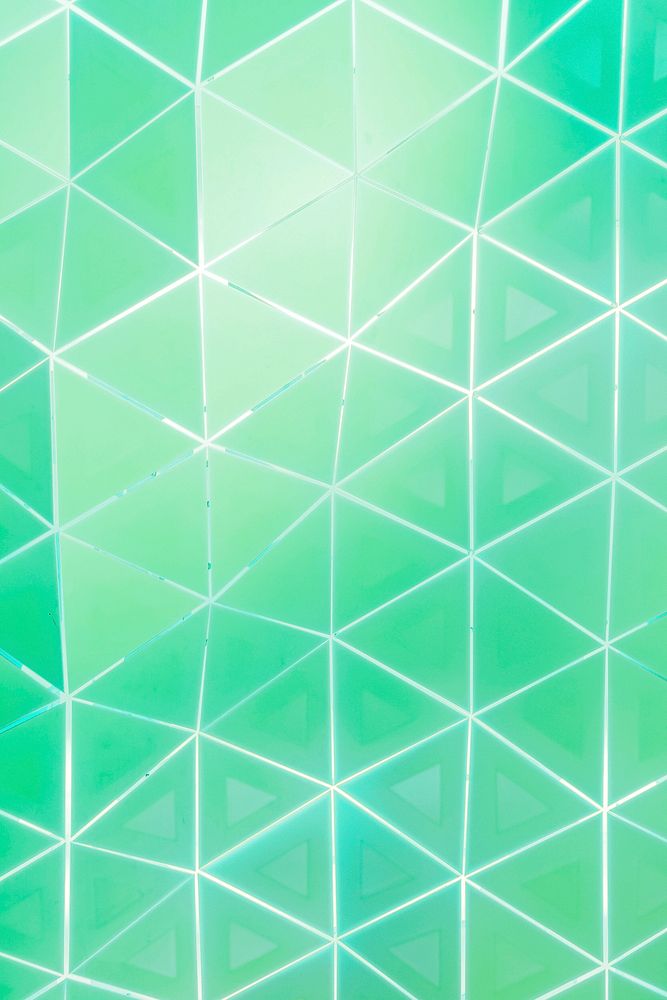 Green and white triangle patterned background vector