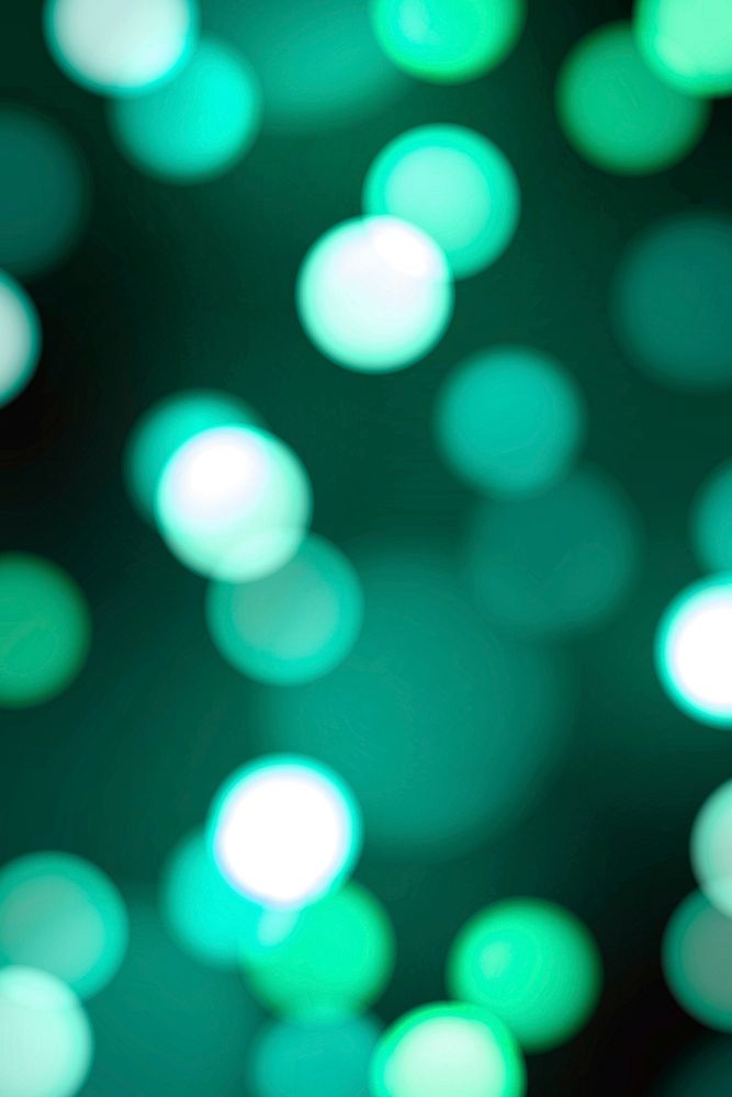 Turquoise green bokeh patterned background