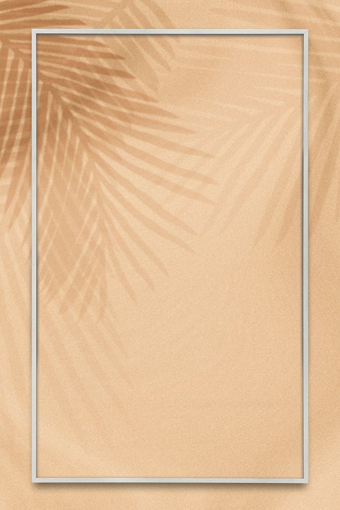 Tropical rectangle frame on a palm leaves shadow background 