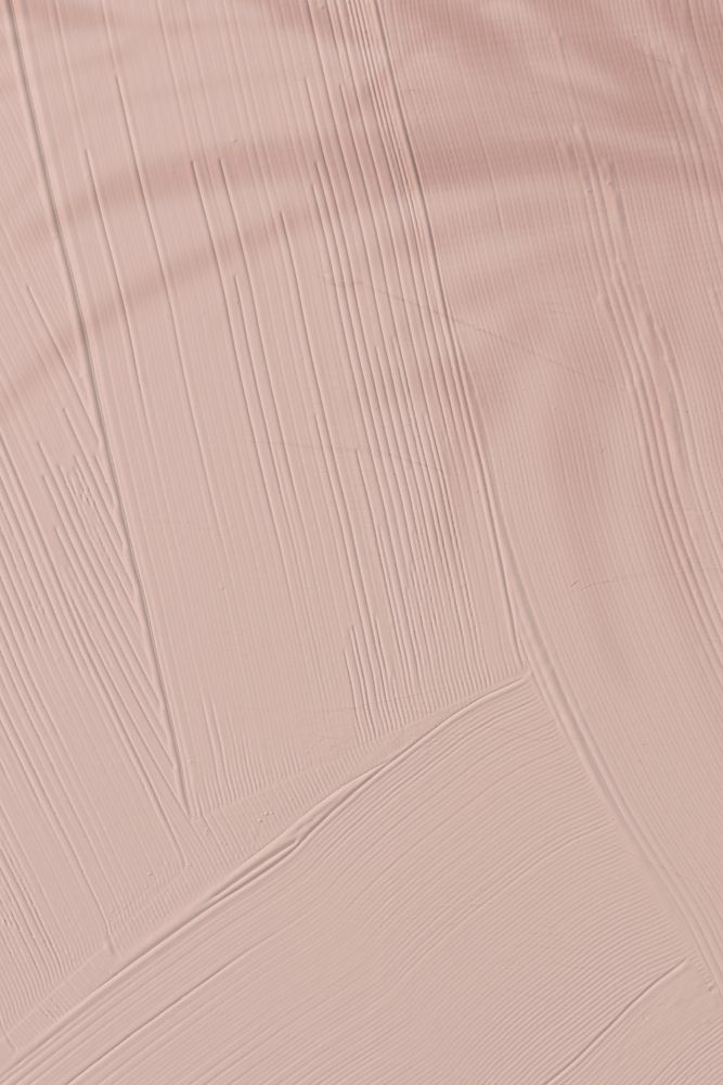 Dull pink paint texture background with leaf shadow