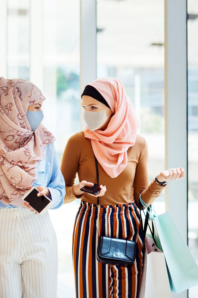 Muslim girls hanging out in face masks at the mall