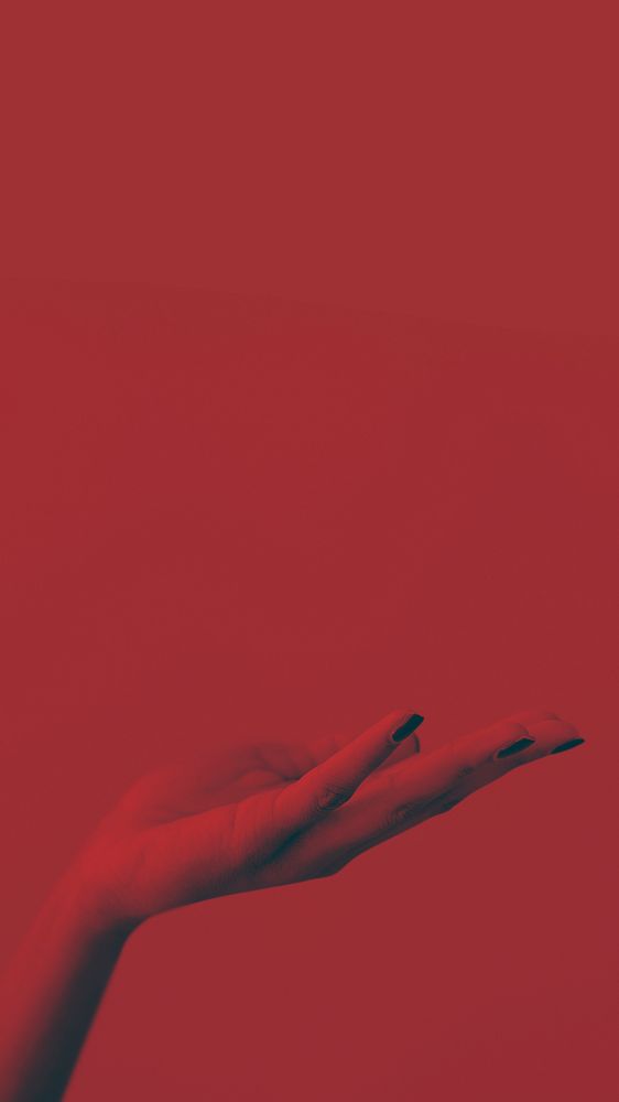 Woman hand on red background
