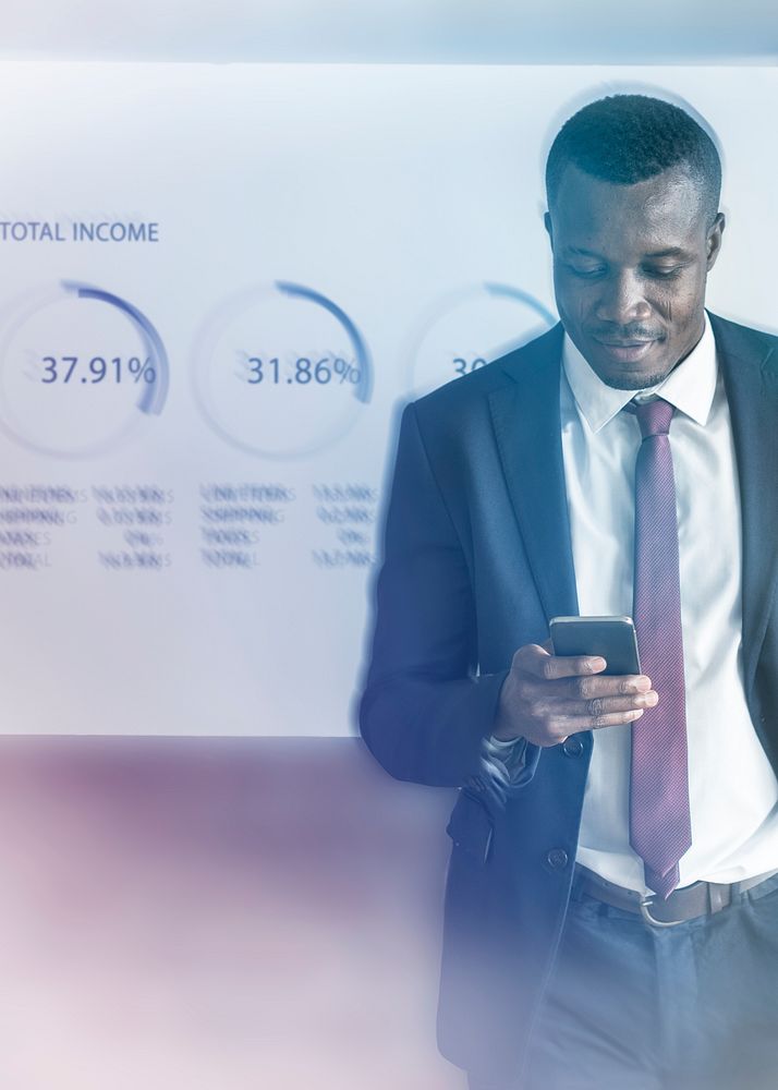Financial analyst using smartphone with business report background