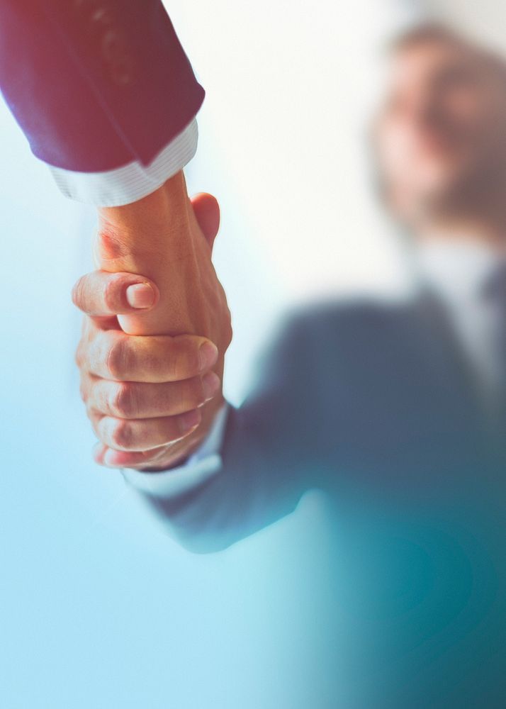 People shaking hands in business agreement